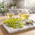 FLAVIA Bright Tea Co. Green Tea with Jasmine Freshpacks on a tray with a cup of tea, best before Dec 24, 2026